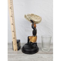 The African with a Shell candle holder