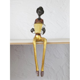 Statuette "Black woman on the shelf (with accordion)"