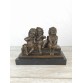 The statuette "Three laughing children"
