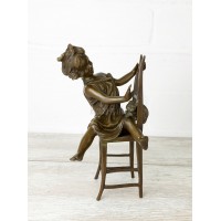 Statuette "A girl with a kitten on a chair 2"