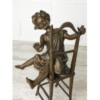 Statuette "A girl with a kitten on a chair 2"