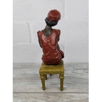 Statuette "A girl wears a stocking (color.)"