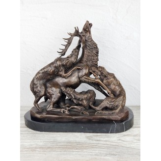 The statuette "Wolves tear up a deer"