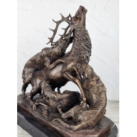 The statuette "Wolves tear up a deer"